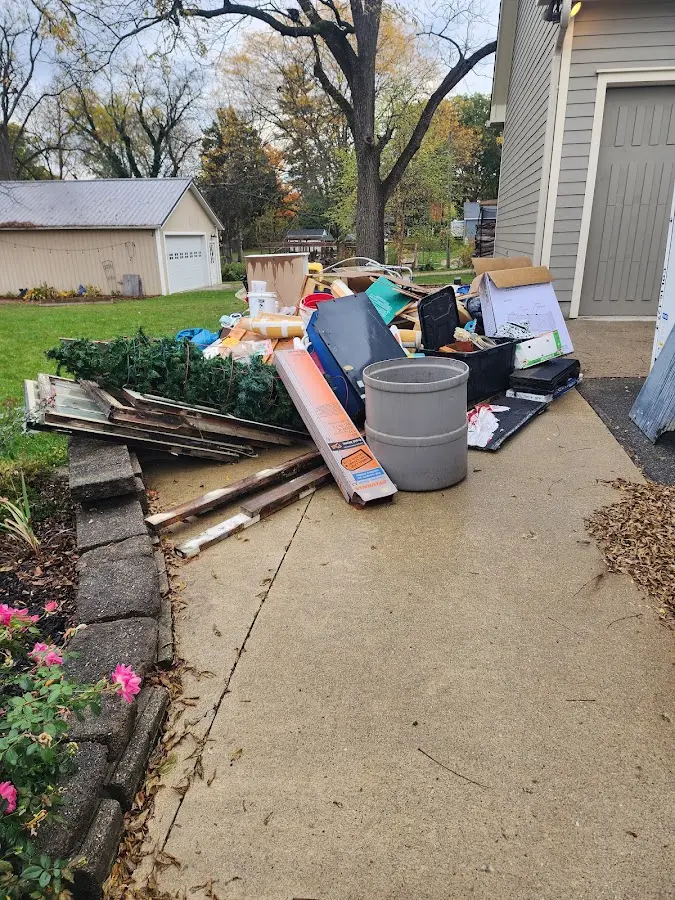 Dumpster being loaded with debris for Commercial Dumpster Rental in Jefferson